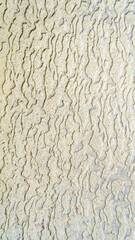 rough texture of paint applied to the wall. abstract texture. Vertical image.
