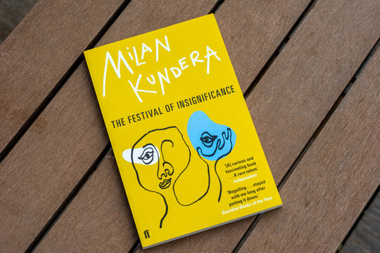 Close up Milan Kundera's The Festival of Insignificance novel in the garden.