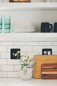 White Open Shelving in Kitchen with Subway Tile Backsplash