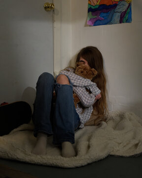 Sad Child Alone in Room