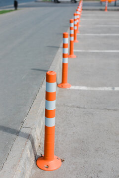 Orange fence on the street. 