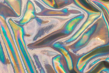 Metallic texture with a wrinkled colorful surface. Abstract neon background texture