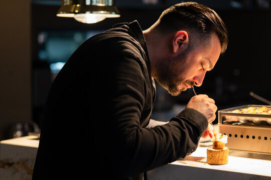 Chef preparing Takoyaki, a delicious octopus japanese croquettes