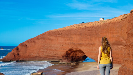 Red natural arch and atlantic ocean- tour tourism in Morocco
