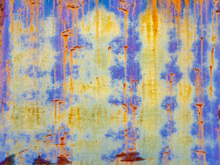 multi-colored paint over rusty metal