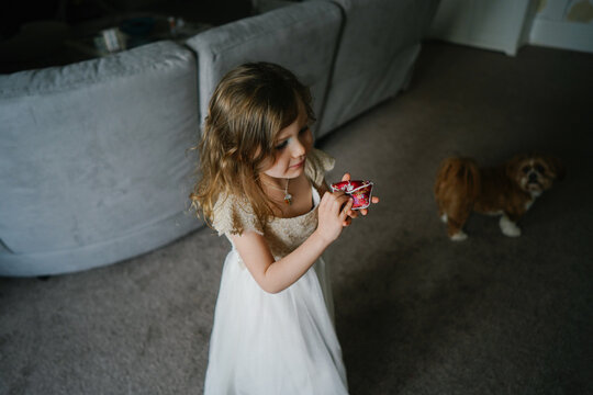Little girl in dress playing at home