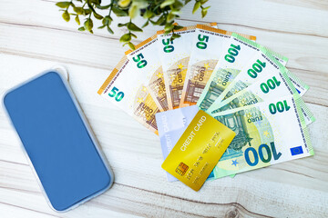 Group of money EURO banknotes  and Credit card arranged on wood background.Credit card on the EURO banknotes  isolated. Exchange money, EURO currency, money, cash, finances,Travel concept.