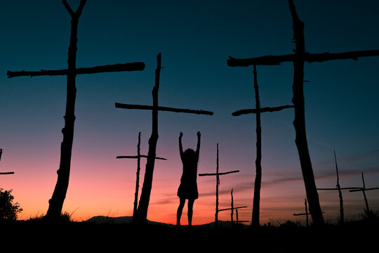 Woman feeling alive at symbolic trees graveyard