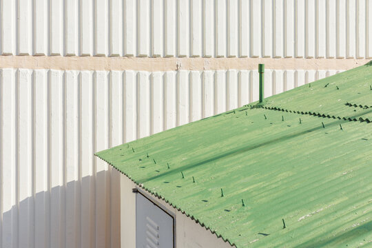 Texture of green roof and wall of the building.