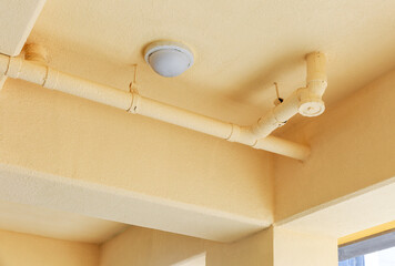 Yellow ceiling and plumbing.