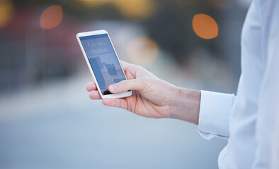 Hand, smartphone screen and city for job, opportunity or search on recruitment website for work. Man, mobile phone ux and company with we are hiring banner, human resources advertising or career goal