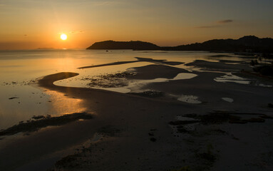 Thong Krut sandbanks and low tide in golden sunset light and ocean - Koh Samui island in Thailand