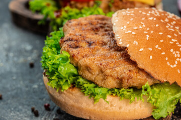 Fast food Burger with beef, tomato, cheese, and lettuce. junk food concept