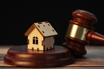 judge gavel with wooden house. Concept of law system, real estate auction, division of property