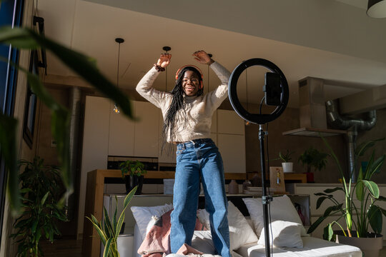 Woman dancing and recording videos for tik tok
