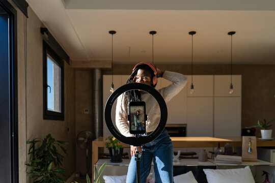 Woman dancing and recording videos for tik tok