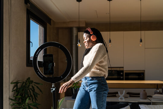 Woman dancing and recording videos for tik tok