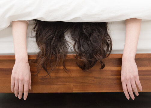 Young woman sleeping in bed