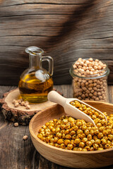 fried chickpeas on a dark background. Traditional Indian cuisine. Tasty vegetarian and vegan chickpea snack. vertical image. top view. place for text