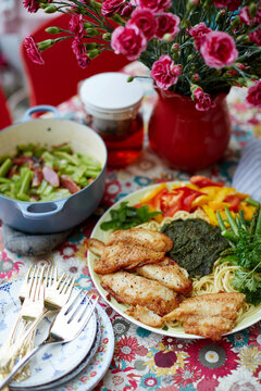 Homemade food, pasta with cod and vegetables pesto