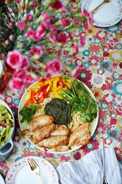 Homemade food, pasta with cod and vegetables pesto