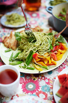 Homemade food, pasta with cod and vegetables pesto