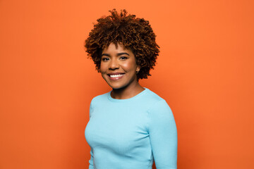 Smiling black woman with curly hair