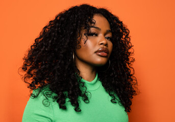 Serious black woman with curly hair