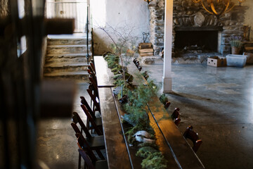 Decorated table with floral arrangements at an indoor dinner party