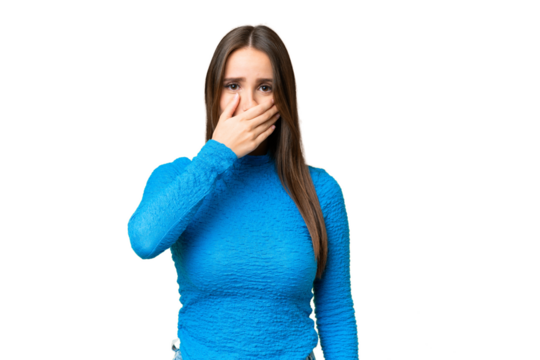 Young beautiful woman over isolated chroma key background covering mouth with hand