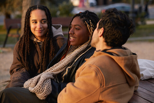 Group of friends talking and enjoying the outdoors