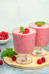 raspberry dessert in glass jar with berries. Yogurt cocktail on a white background. place for text, top view