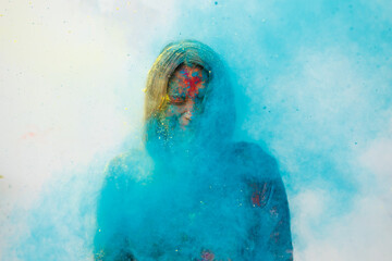 Young woman enjoying Holi,the festival of color 