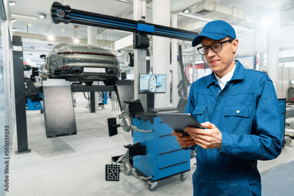 Poster serviceman with digital tablet on the background of the car in the car service