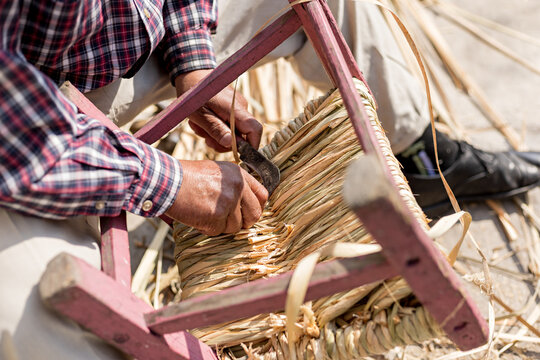 Close Up Of A Craftsman Cutting The Burrs From A Seat