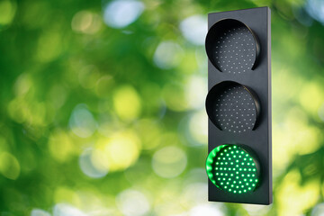 Green traffic light. Symbol of  sustainable energy and development