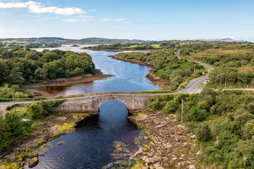 Fototapeta na wymiar Aerial view of the bridge over Lackagh river close to Doe Castle by Creeslough in County Donegal, Republic of Ireland