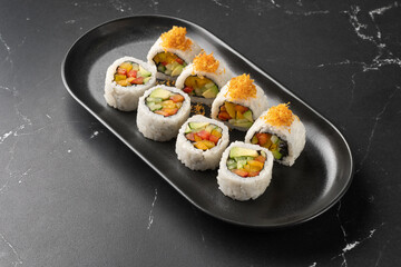 Vegan Futomaki with zucchini, celery stalks, carrot, red cabbage, red bell pepper