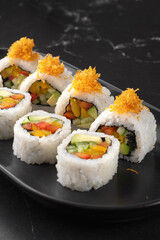 Vegan Futomaki with zucchini, celery stalks, carrot, red cabbage, red bell pepper