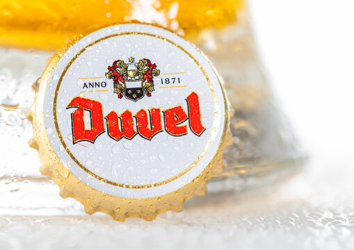 LONDON, UK - DECEMBER 22, 2022: Beer cap with dew from Duvel beer bottle on white background.