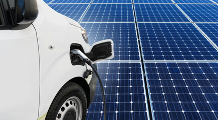 Electric van with charging station on a background of solar panel 