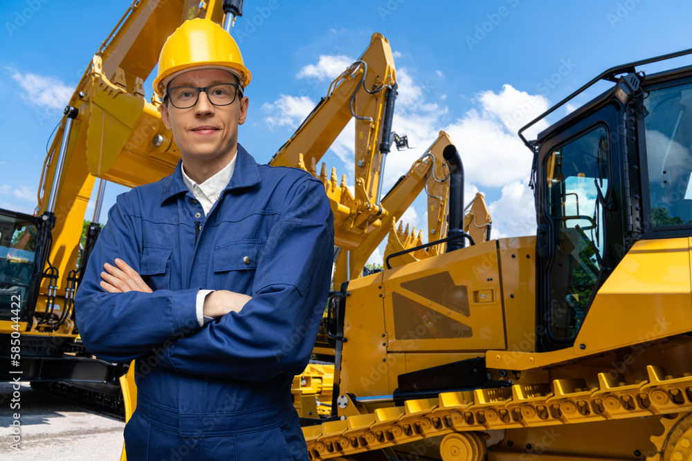 Aufkleber engineer in a helmet on the background of construction machines