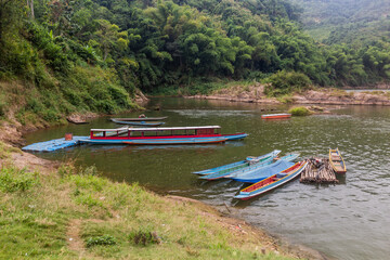 Boats on Nam Ou river in Hat Sa village in Phongsali province, Laos