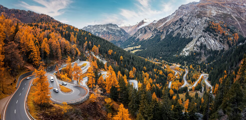 Wonderful Nature landscape of Switzerland. Vivid autumn scenery of Maloja pass, Switzerland, Europe. Amazing, serpentine road is a most popular place of travel and Outdoor vacations in Swiss alps. - 585049868