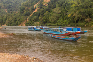 Boats at Nam Ou river in Muang Khua town, Laos