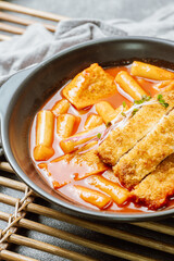 Tteokbokki, Stir-fried Rice Cake : Sliced rice cake bar (garaetteok) or thin rice cake sticks (Tteokbokkitteok) stir-fried in a spicy gochujang sauce with vegetables and fish cakes.