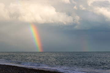 rainbow on the sea after the rain