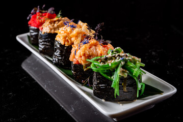Set Gunkan Maki Sushi with Seafood on plate