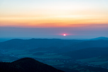 Sunrise from Cwervena hora hill in Jeseniky mountains in Czech republic