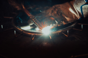 Close up of the steel welding process. Work in the heavy steel industry